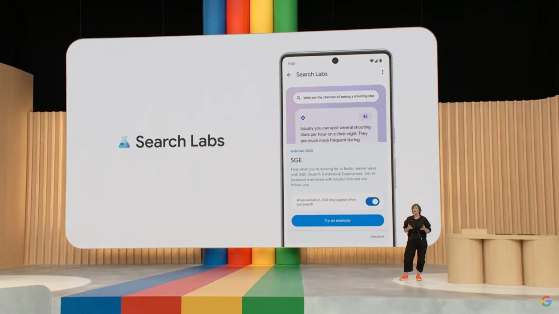 Person presenting Google Search Labs features on screen.